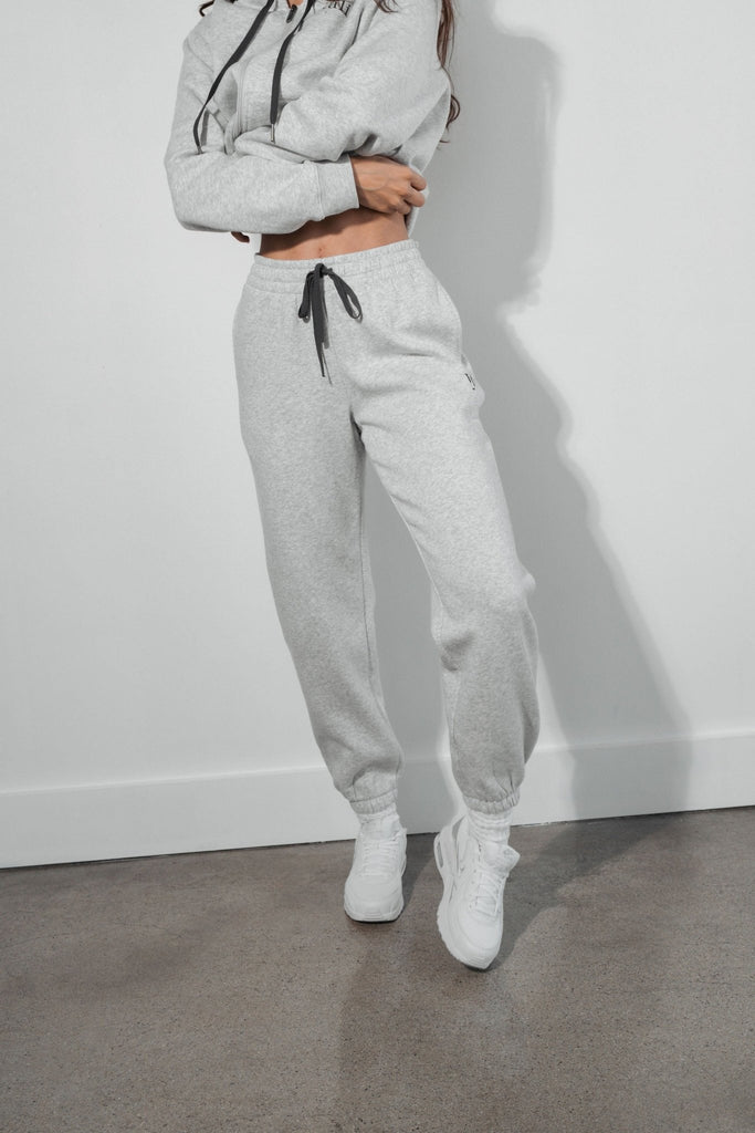 A woman wearing the Vitality Cozy Uni Jogger in Stone Marl