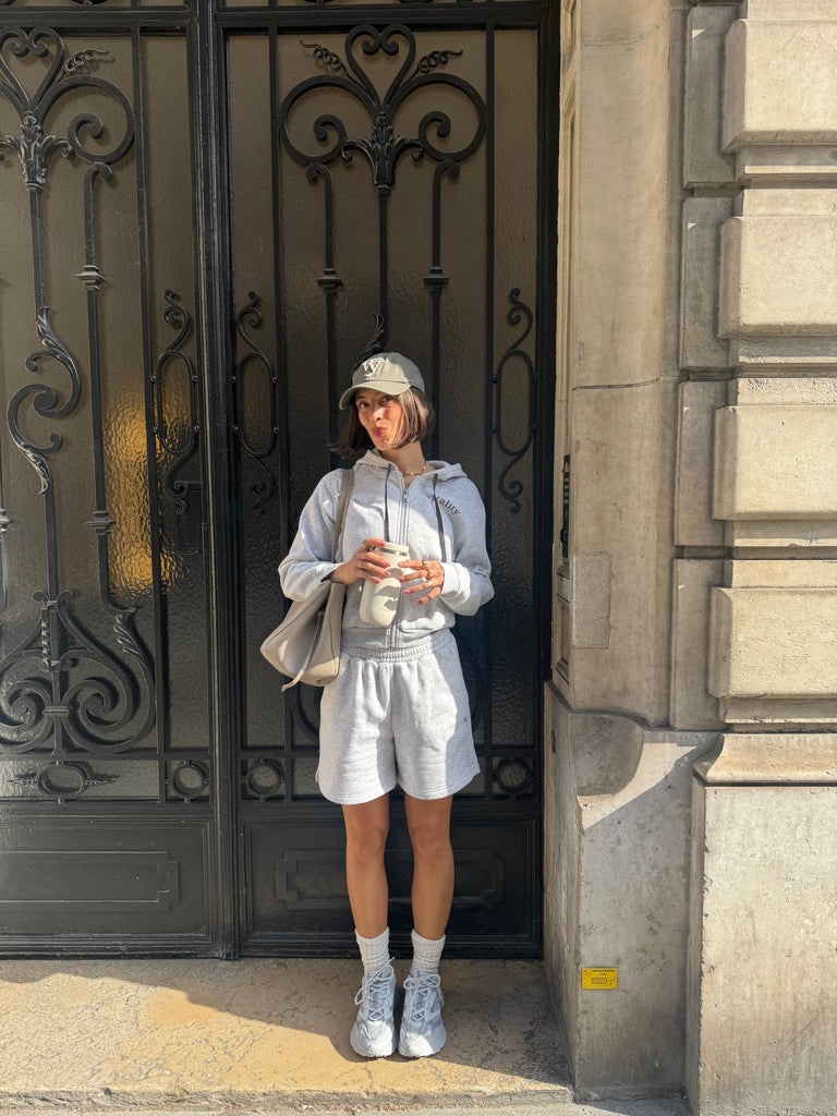 A woman wearing the Vitality Cozy Uni Short in Stone Marl