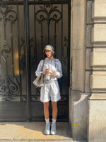 A woman wearing the Vitality Cozy Uni Short in Stone Marl