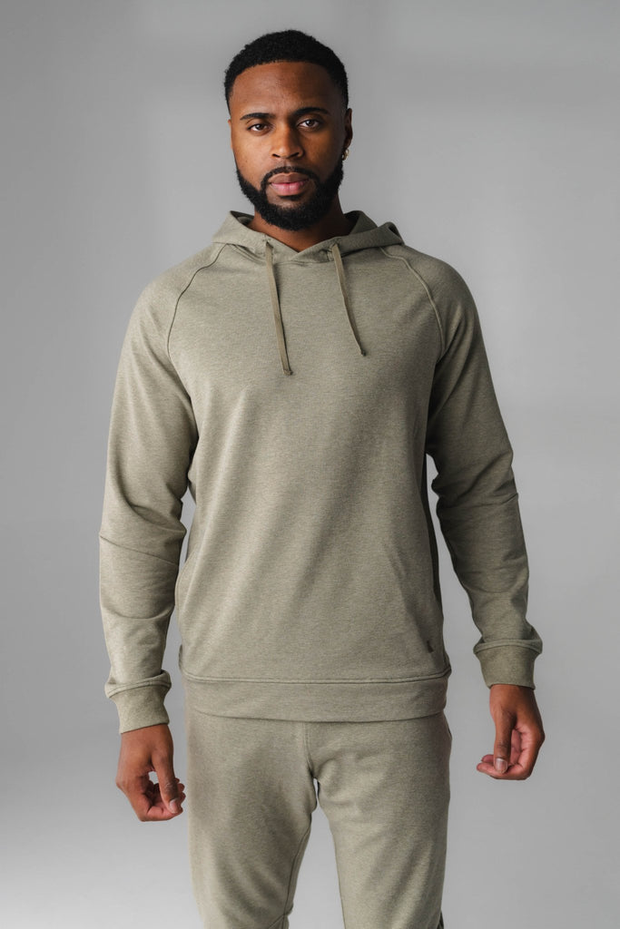 A man wearing Matcha Marl Studio Hoodie